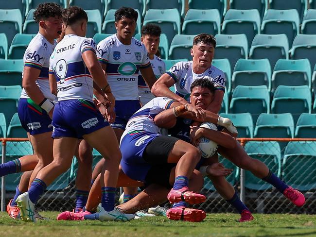 Cyrus Bloomfield mauled by the Warriors defense. Picture: Adam Wrightson Photography.