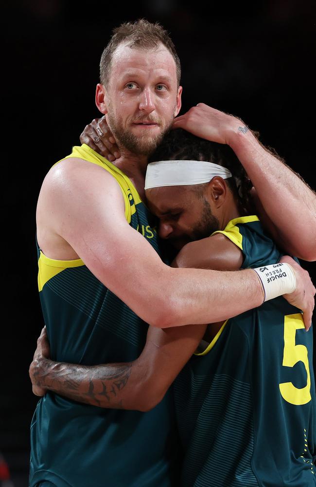 Joe Ingles and Patty Mills embrace after Australia win the bronze medal in Tokyo. Picture: Kevin C. Cox/Getty Images