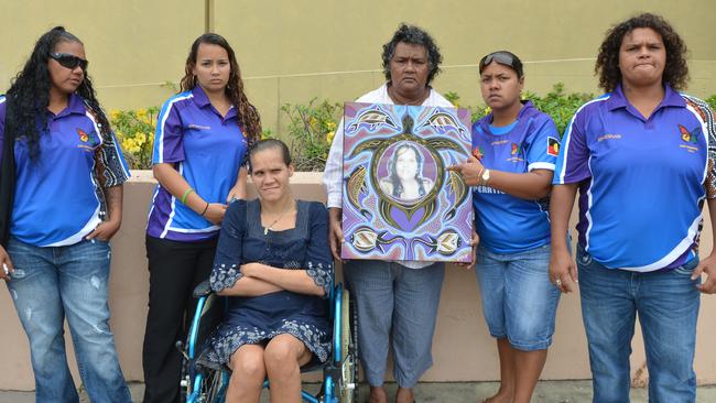 Family of Amanda Kay Sauney, 25, outside the Mackay Courthouse after her murderer Antony Daniel Morseu was sentenced to life in jail for her murder. (L-R): Justine Sauney, Ashley Sauney, Kimberley Sauney, her mother Maxine Sauney, Nikita Sauney (holding a photo and artwork of Amanda) and Colleen Sauney. Photo Lee Constable / Daily Mercury