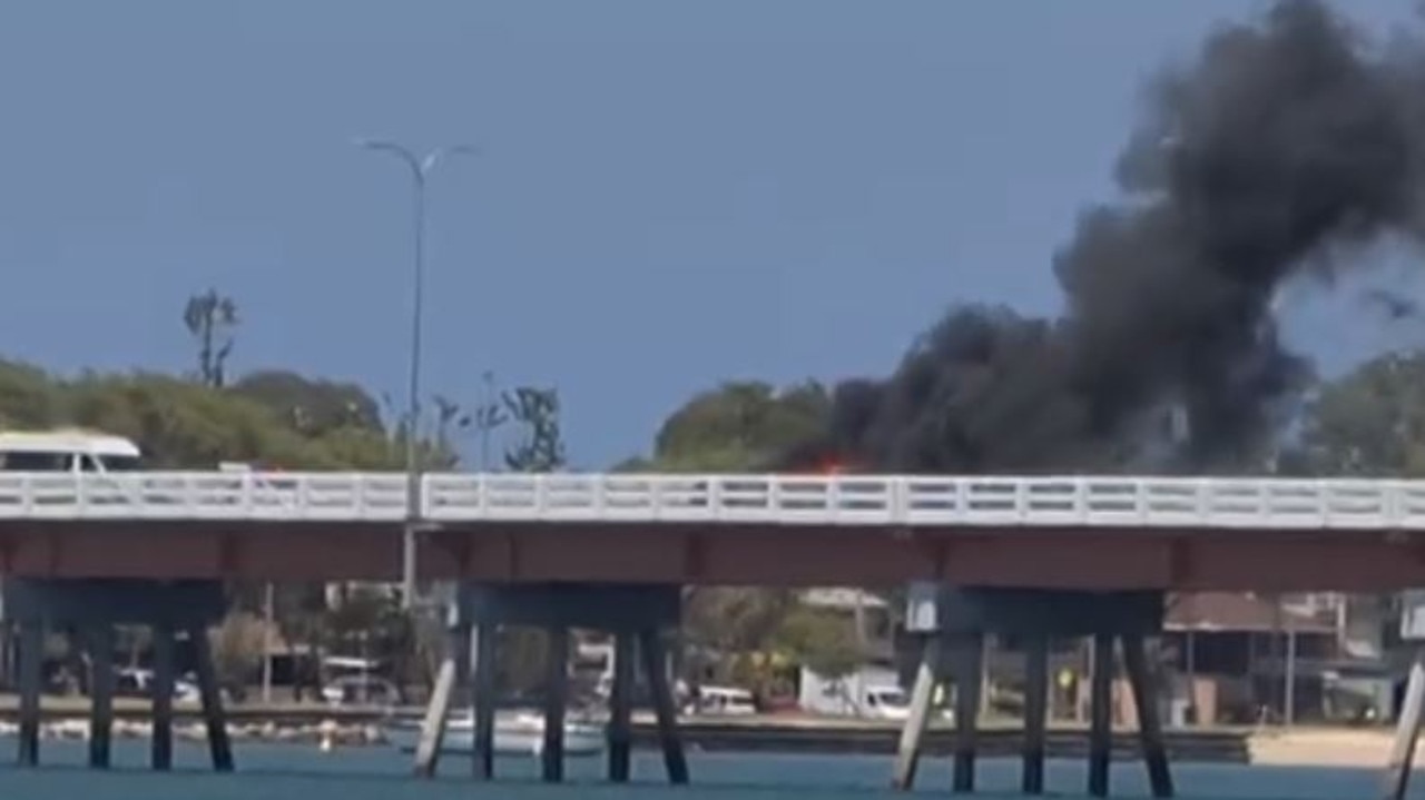 Bribie Island Bridge has turned into an inferno zone this afternoon, following a two car crash in the middle of the bridge causing a large fire. Source: Facebook