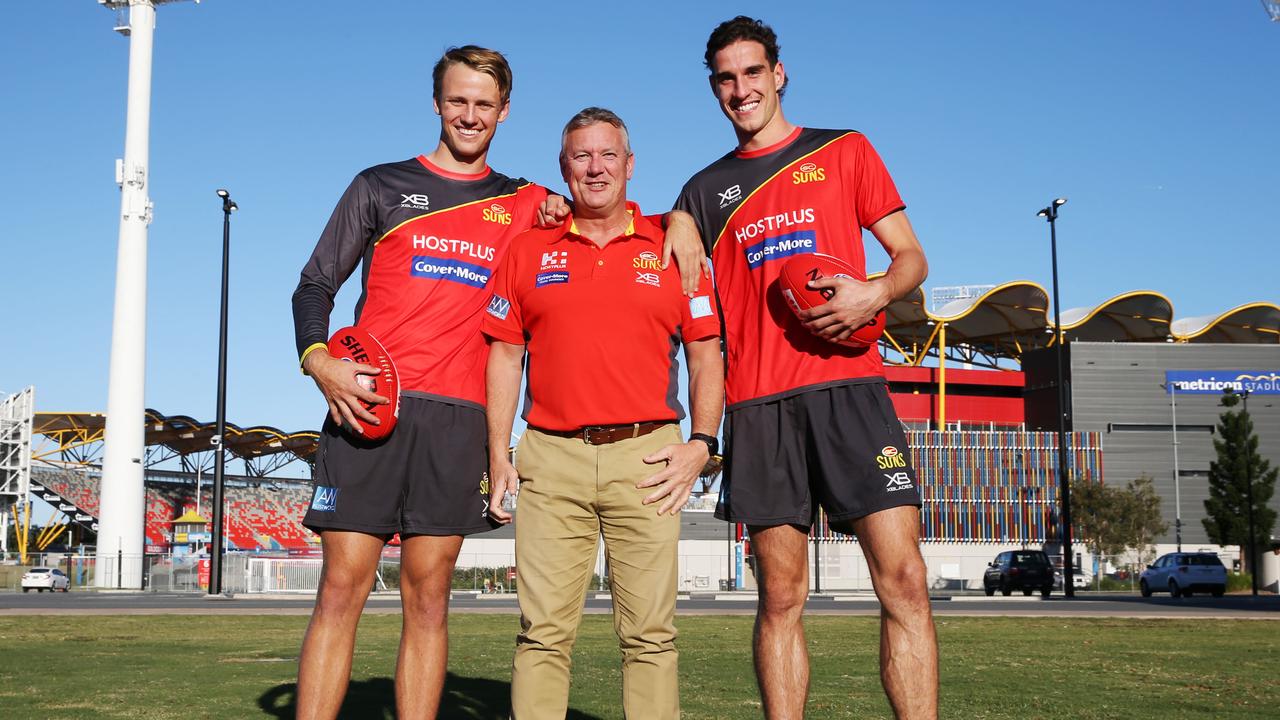 Suns CEO Mark Evans, with rookies and 'adopted' players Jack Lukosius and Ben King outside Metricon Stadium. Photo: Glenn Hampson
