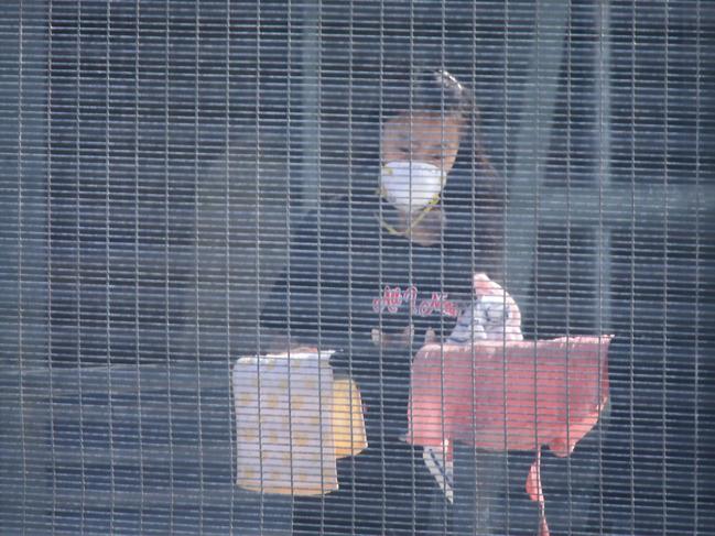 Australians evacuated from Wuhan, China, inside the Christmas Island Detention centre doing washing. Picture: Nathan Edwards