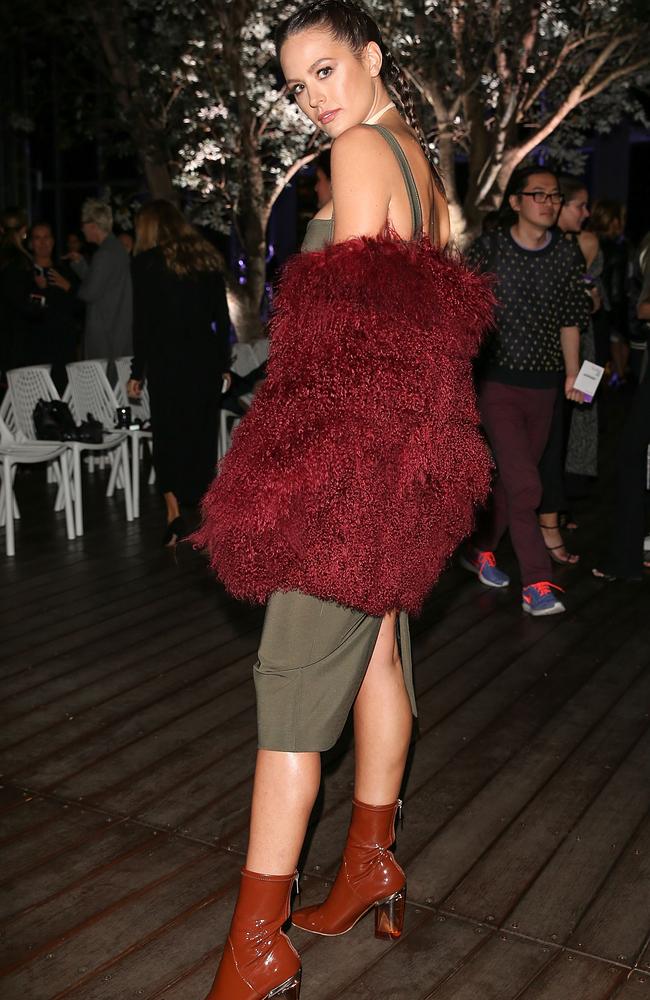 Jessinta Campbell says her eye-grabbing crimson coat is made from ‘ethical fur’. Picture: Caroline McCredie/Getty Images