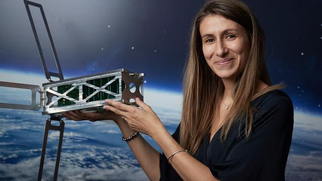 Flavia Tata Nardini from Fleet Space with one of the company’s nano satellite prototype at the conference. Picture: AAP / Matt Loxton