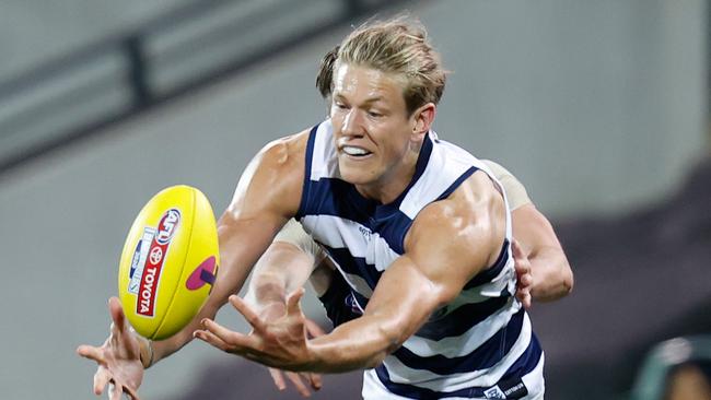 Geelong ruckman Rhys Stanley tries to take possession.