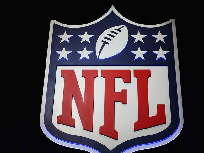 (FILES) This file photo taken on January 31, 2017 shows the NFL shield logo seen following a press conference held by NFL Commissioner Roger Goodell (not pictured) at the George R. Brown Convention Center in Houston, Texas.    The National Football League is mulling a crackdown on foul play that would see ejections for players who aim hits at an opponent's head, officials said on March 22, 2017. NFL Executive Vice President for Football Operations Troy Vincent said on Twitter the league was studying the move as part of an effort to eradicate head shots.  / AFP PHOTO / GETTY IMAGES NORTH AMERICA / Tim Bradbury