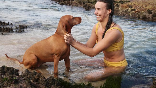 Alice Matthews, 28, is pictured with her dog Till near Tamarama Beach during the COVID-19 lockdown in Sydney. Picture: David Swift