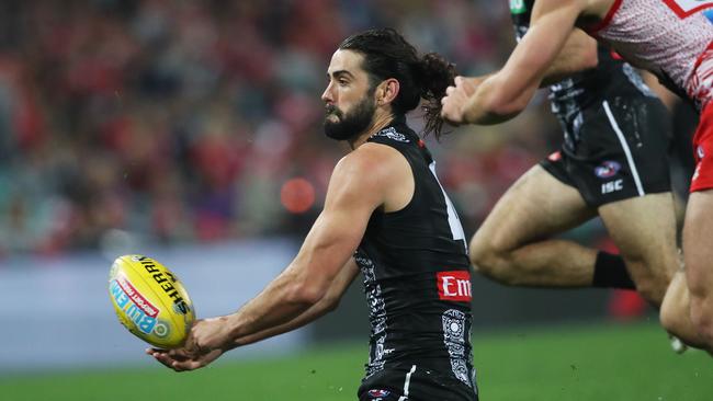 Collingwood's Brodie Grundy handballs during AFL Indigenous Round match between the Sydney Swans and Collingwood Magpies at the SCG on May 24, 2019. Picture. Phil Hillyard