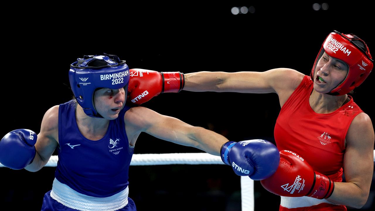 Rosie Eccles (blue) of Team Wales competes against Kaye Frances Scott (red) of Team Australia