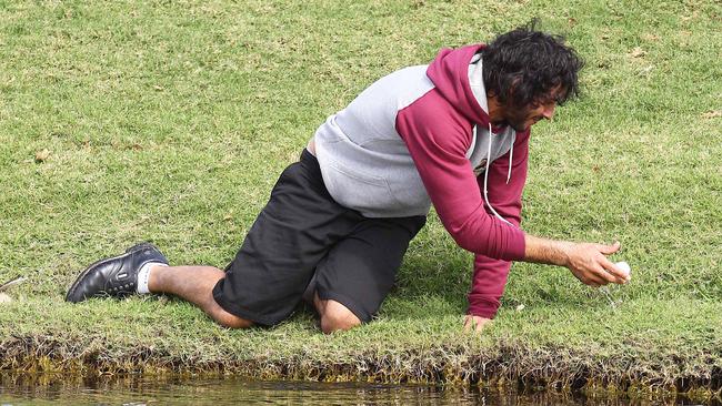 Johnathan Thurston has improved his golf game considerably since this 2010 picture from Maroons camp at Coolum. Picture: Peter Wallis