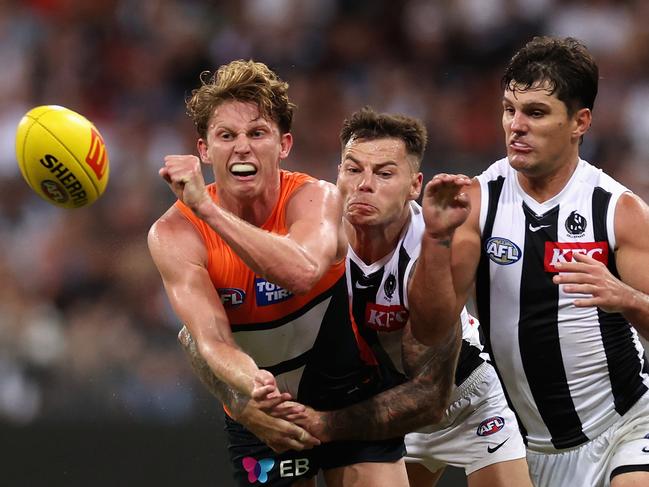 Lachie Whitfield of the Giants escapes Collingwood forwards. Picture: Cameron Spencer/Getty Images.