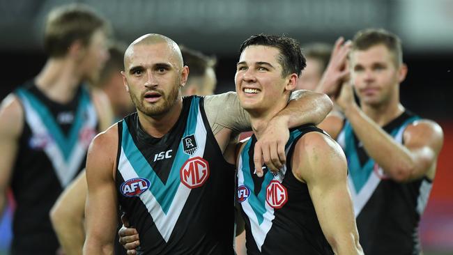 GOLD COAST, AUSTRALIA – SEPTEMBER 05: Sam Powell-Pepper and Connor Rozee of Port Adelaide celebrates victory during the round 16 AFL match between the North Melbourne Kangaroos and the Port Adelaide Power at Metricon Stadium on September 05, 2020 in Gold Coast, Australia. (Photo by Matt Roberts/AFL Photos/via Getty Images)