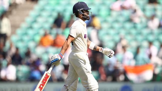 Kohli walks off after being dismissed by Todd Murphy during the first Test. Picture: Getty Images