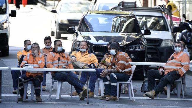 Workers who stopped traffic in Melbourne on Friday over the closure of tearooms. Picture: Andrew Henshaw