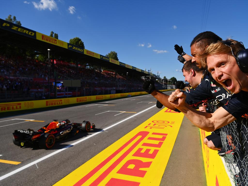 Race winner Max Verstappen of the Netherlands driving the (1) Oracle Red Bull Racing RB18 passes his team celebrating on the pitwall. Picture: Dan Mullan/Getty Images