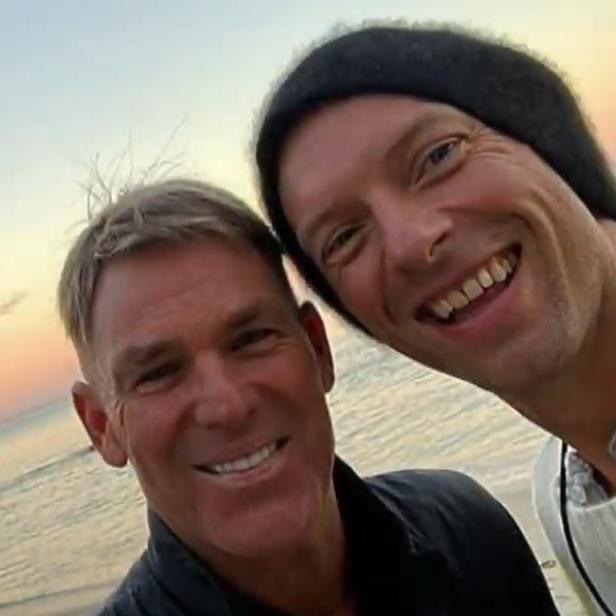 Warne with Chris Martin. Picture: YouTube