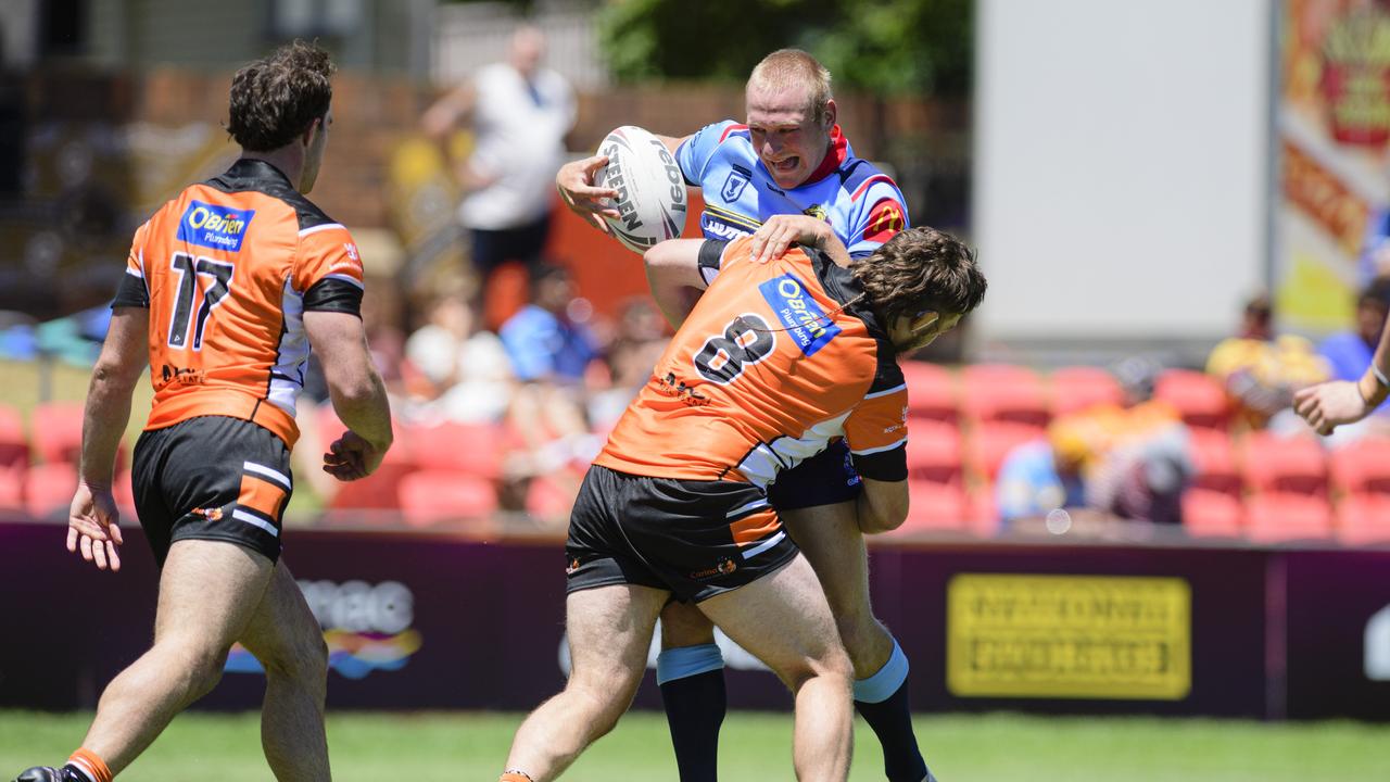 Flynn Kaiser-Capewell (top) of Western Clydesdales is tackled by Maddison Beckett of Carina Brisbane Tigers in pre-season Host Plus rugby league at Toowoomba Sports Ground, Sunday, February 16, 2025. Picture: Kevin Farmer