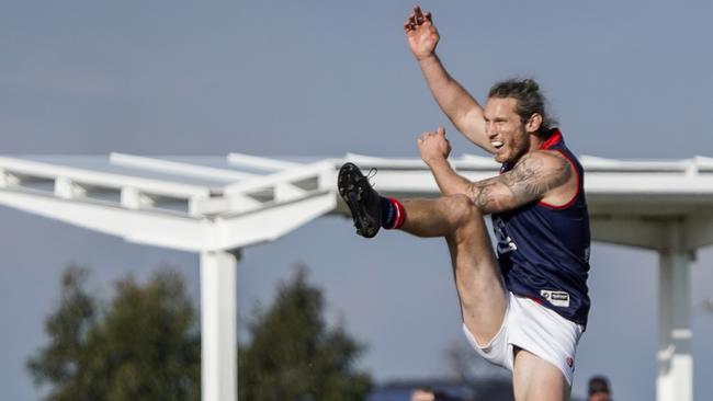 Tyrone Vickery takes a kick for Springvale Districts. Picture: Valeriu Campan