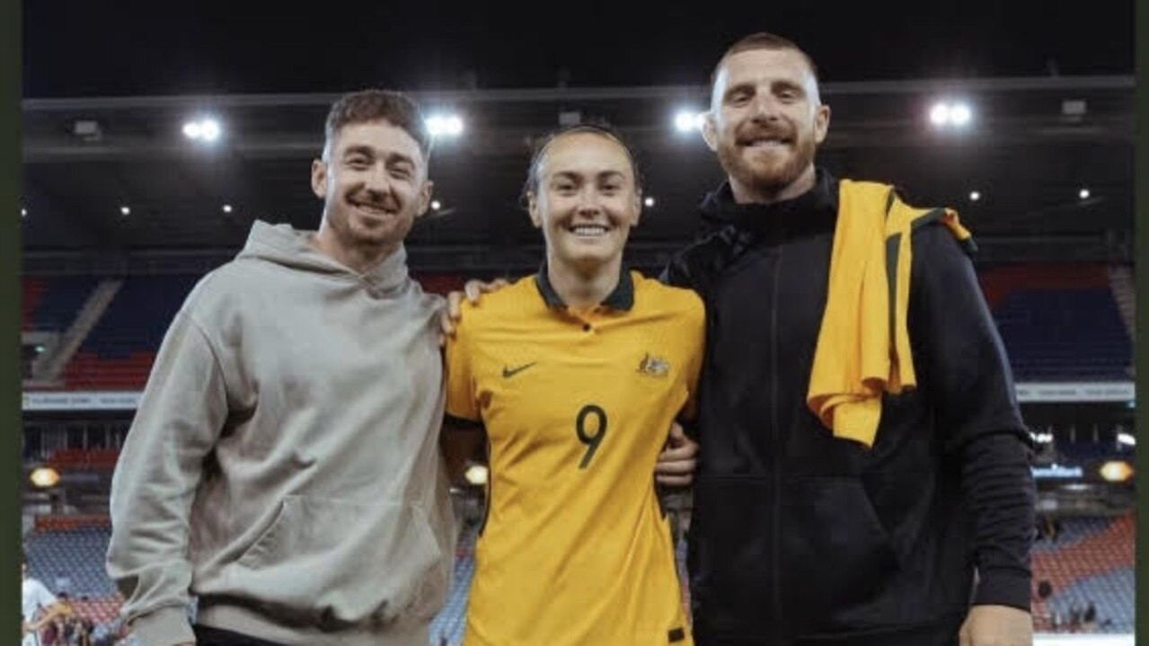 Knights stars Adam Clune and Jackson Hastings with Caitlin Foord after the Matildas victory in Newcastle.