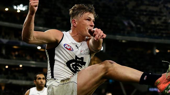 PERTH, AUSTRALIA - AUGUST 15: The Blues celebrate after Jack Newnes scores a goal after the siren to win the match during the 2020 AFL Round 12 match between the Fremantle Dockers and the Carlton Blues at Optus Stadium on August 15, 2020 in Perth, Australia. (Photo by Will Russell/AFL Photos via Getty Images)