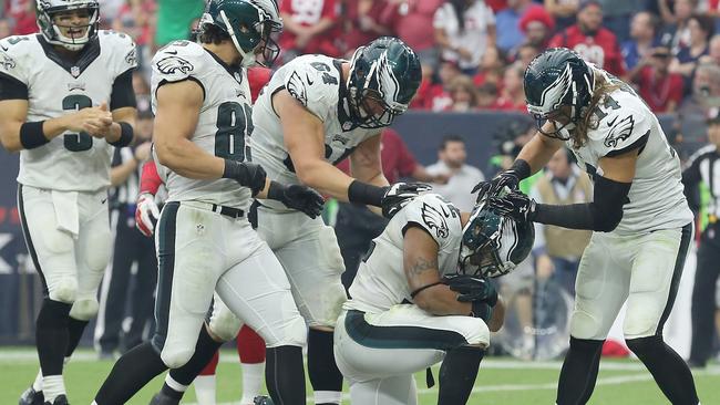 Chris Polk and teammates celebrate his touchdown agains the Houston Texans.