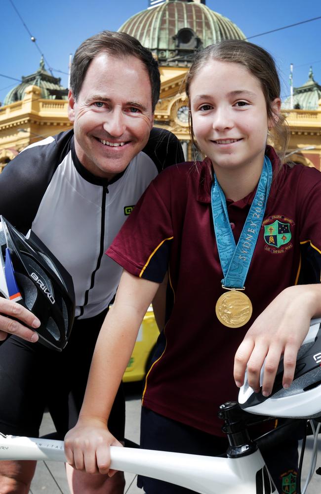 Olympic gold medal cyclist Scott McGrory, with his daughter Maddy. Picture: Nicole Cleary