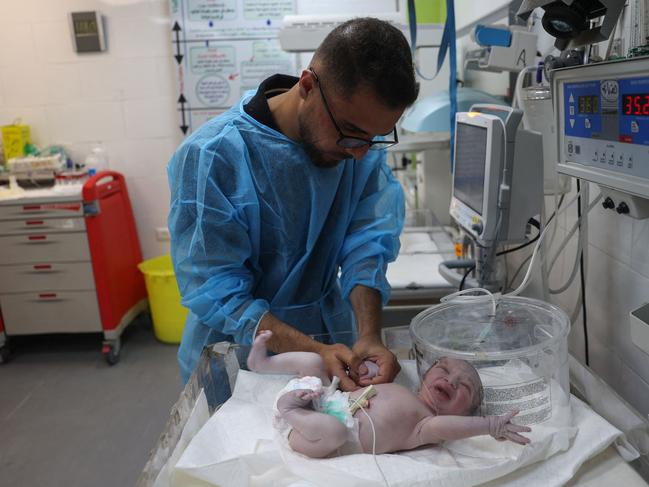 A Palestinian medic cares for babies born preterm amid the ongoing conflict between Israel and the Hamas movement, at the Emirati hospital in Rafah in the southern Gaza Strip. Picture: AFP