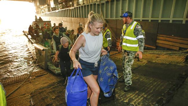 Another boat load of evacuees arrives. Picture: David Caird