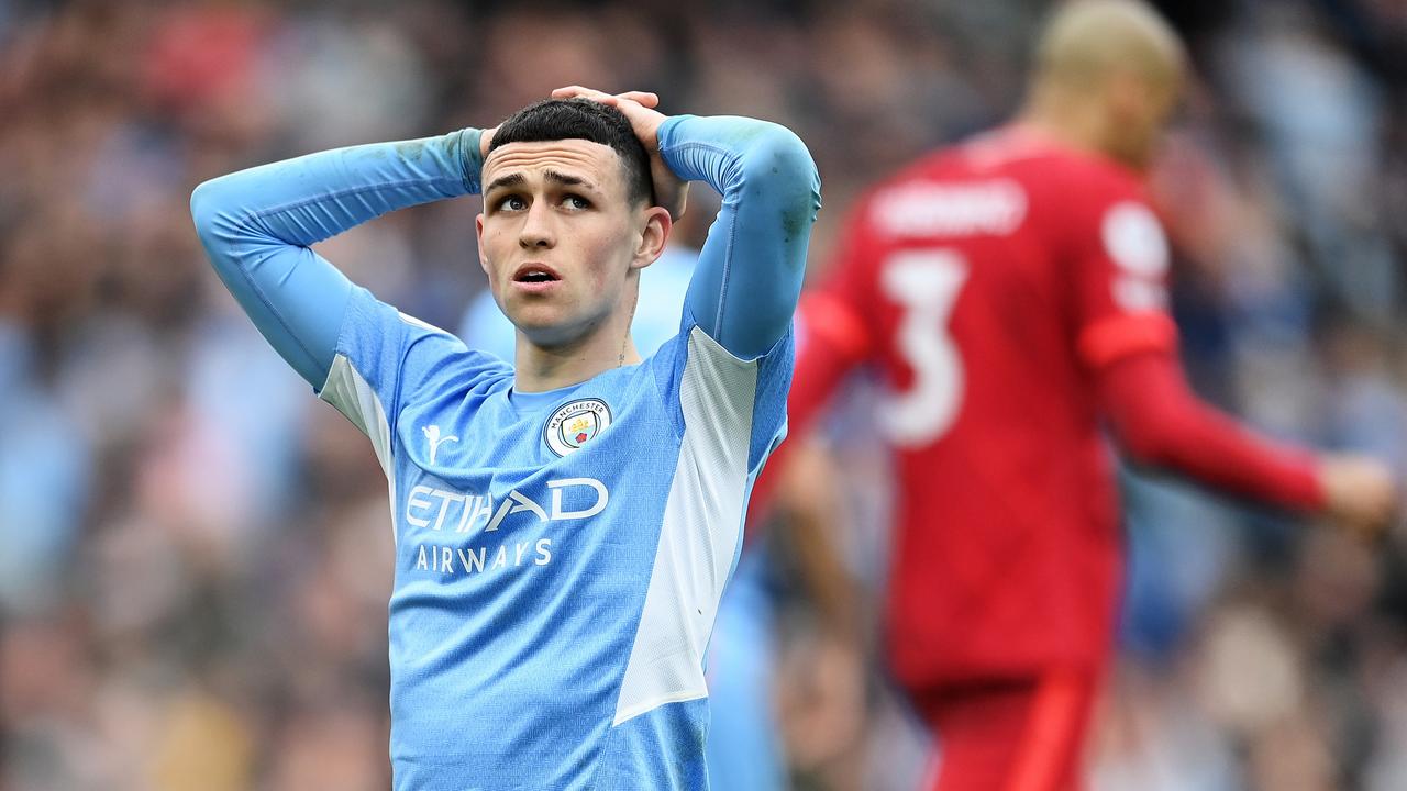 Phil Foden of Manchester City looks dejected after Riyad Mahrez (not pictured) misses a chance during the Premier League match between Manchester City and Liverpool at Etihad Stadium. (Photo by Michael Regan/Getty Images)