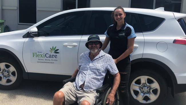 Bowen Flexi Care client Ray Halls and staff member Shannon Colquitt. The support service just scored funding from the QCoal Foundation. Photo: Contributed