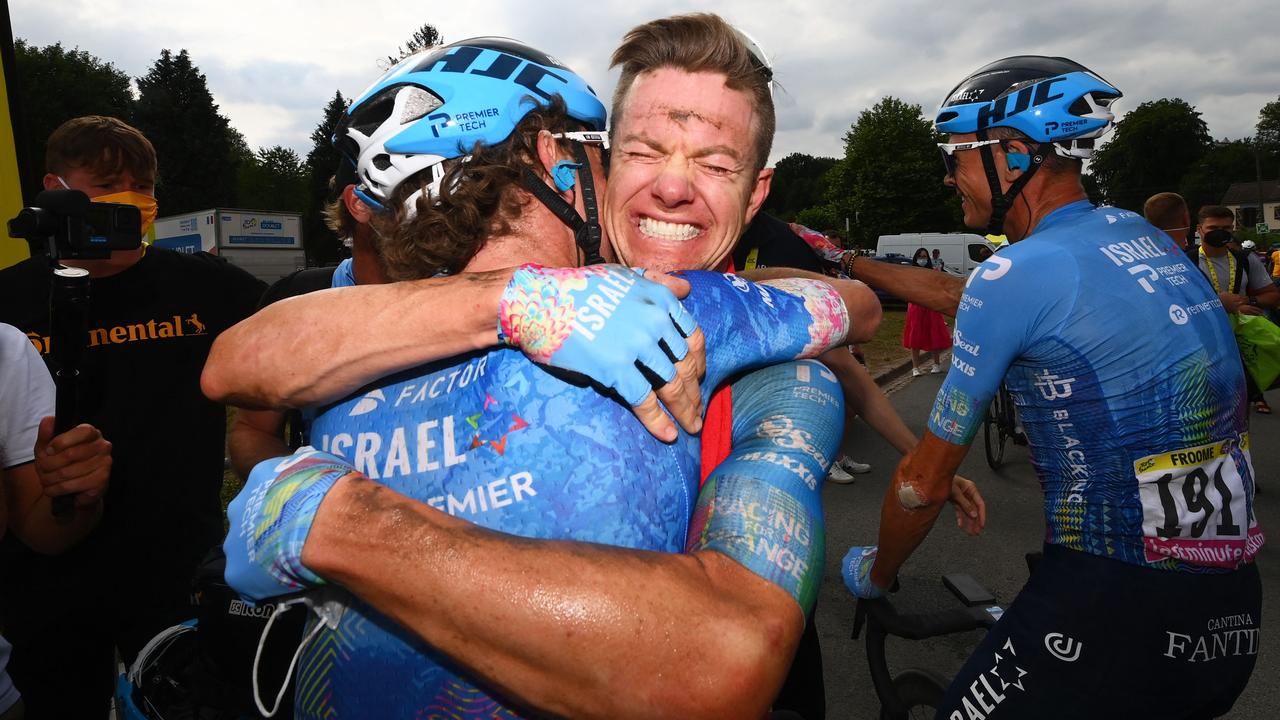Israel-Premier Tech team's Simon Clarke celebrates with teammate Chris Froome. (Photo by Tim De Waele / AFP)