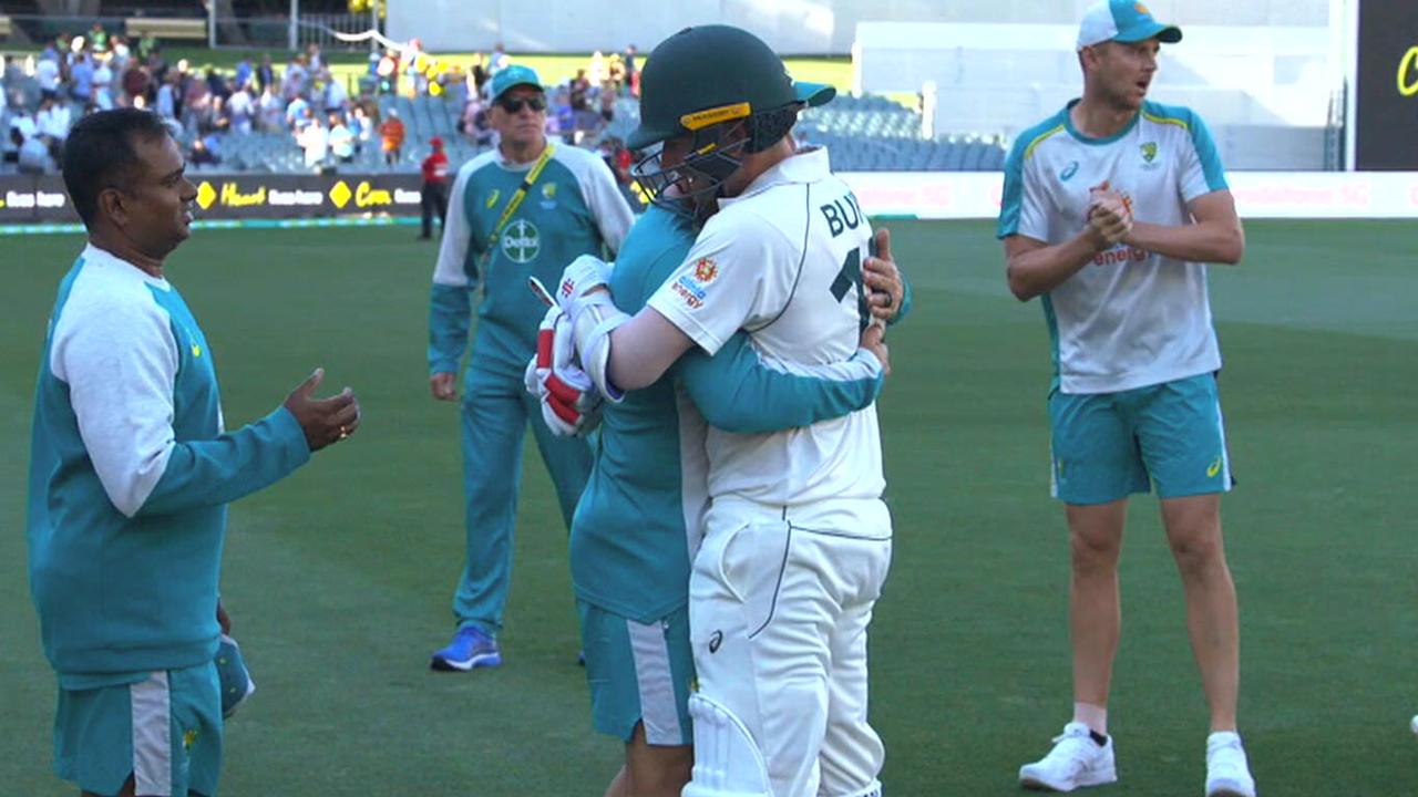 Justin Langer congratulates Joe Burns after his half century guided Australia home.