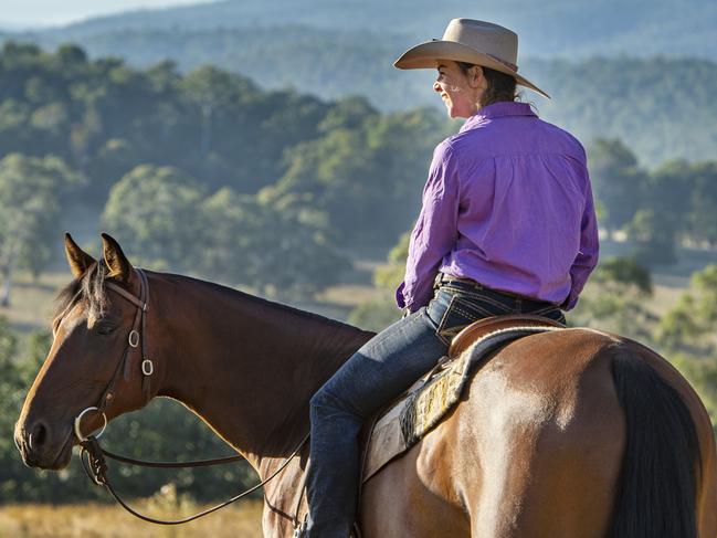 Country Living: Kathy GabrielKathy Gabriel on her farm near Benambra in the Tablelands Valley.PICTURED: Kathy Gabriel with her horse named Memphis and dog named Pete.PHOTOGRAPHER: ZOE PHILLIPS