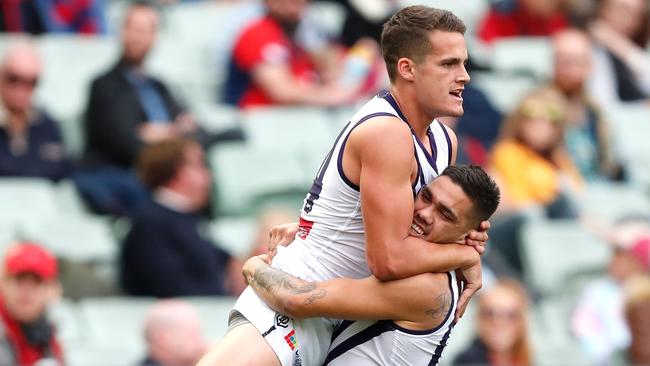 Harley Balic (left) celebrates his first AFL goal with Michael Walters, against Melbourne at the MCG in 2017.