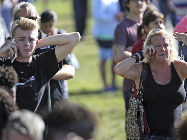 Anxious family members wait for students following the shooting at Marjory Stoneman Douglas High School in Parkland, Florida. Picture: AP