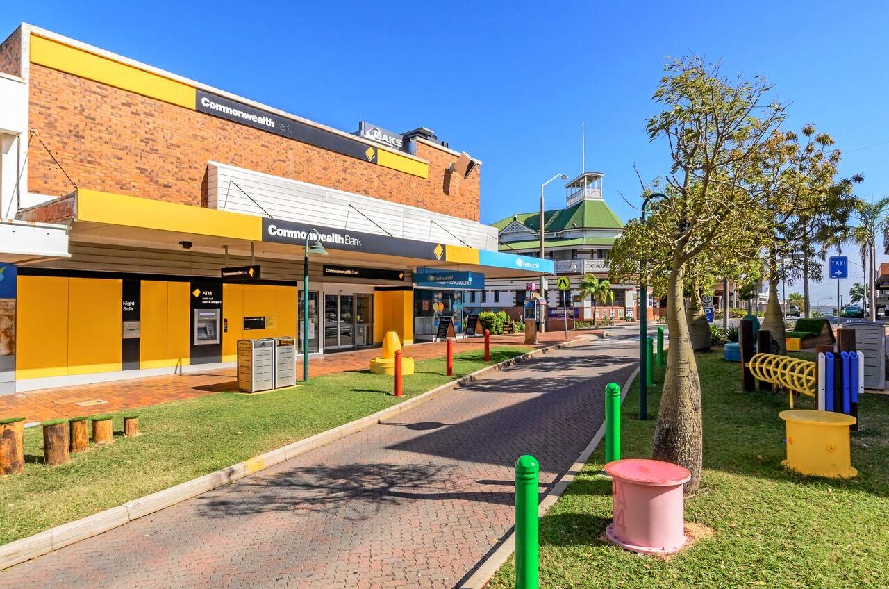 LJ Hooker has listed 81 Goondoon St, where Commonwealth Bank, Uber Hair and Hello World are, for sale.