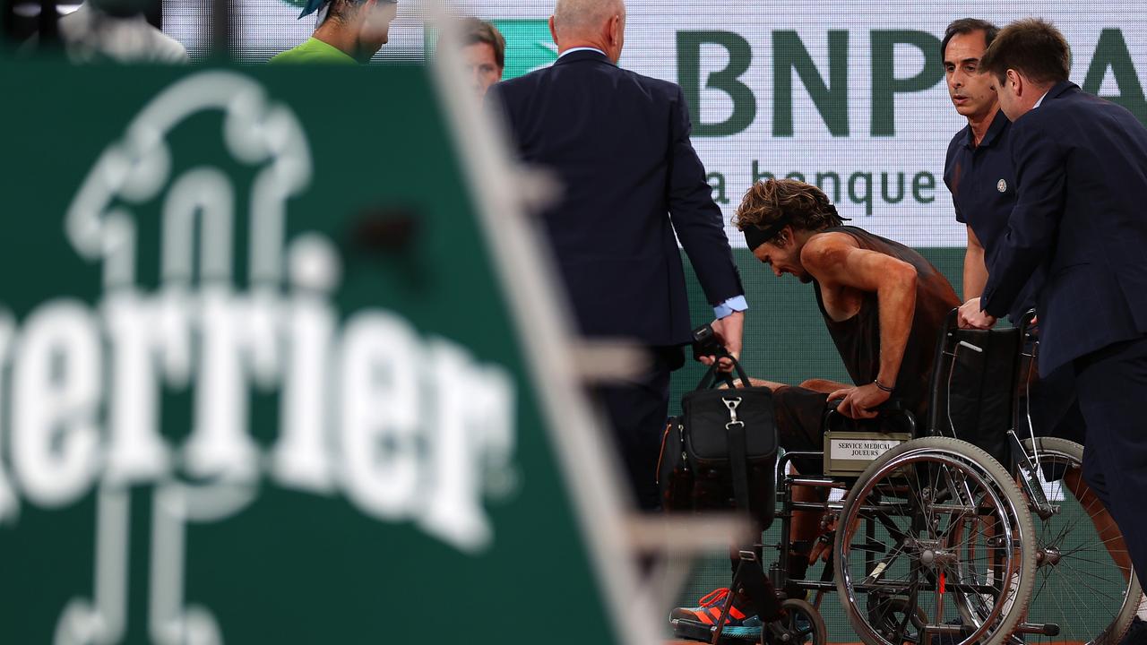 Alexander Zverev is wheeled off. (Photo by Ryan Pierse/Getty Images)