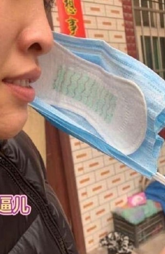 This woman has fortified her surgical mask with a sanitary pad. Picture: Weibo