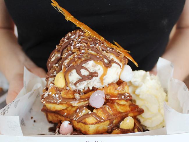 Oh My Waffle Easter special - Easter stack with hot cross bun ice cream, sticky date sauce, toffee shards and Easter eggs. 