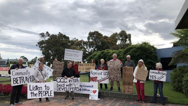 Residents against the Kangaroo Bay development protest outside a secret Clarence City Council Meeting.