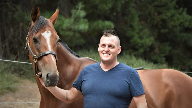 The Inevitable with trainer Scott Brunton at his Seven Mile Beach stables. Picture: Peter Staples