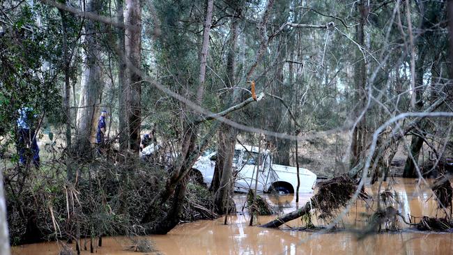 A man’s body was pulled from his ute after it was washed away in floodwaters at Leppington. Pic Stephen Cooper