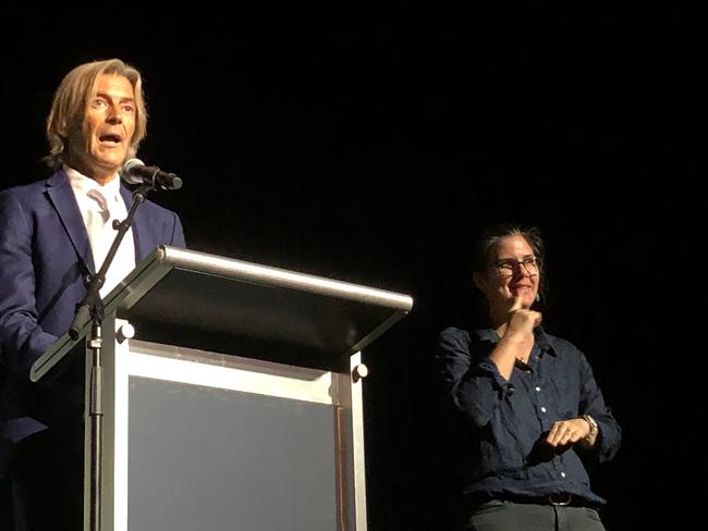 AUSTRLIA DAY AMBASSADOR: Composer and conductor George Ellis spoke movingly about what being Australian meant to him, supported by Auslan interpreter Belinda Roberts. Photo: Alison Paterson