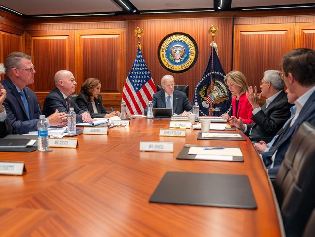 This handout picture provided by the White House shows US President Joe Biden (C) and Vice President Kamala Harris (4th L) being briefed by national security advisors and members of law enforcement agencies in the White House Situation Room in Washington, DC, on July 14, 2024 on the assassination attempt on former US president Trump in Butler, Pennsylvania, the previous day. (Photo by Adam Schultz / The White House / AFP) / RESTRICTED TO EDITORIAL USE - MANDATORY CREDIT "AFP PHOTO /  Adam Schultz / The White House" - NO MARKETING NO ADVERTISING CAMPAIGNS - DISTRIBUTED AS A SERVICE TO CLIENTS