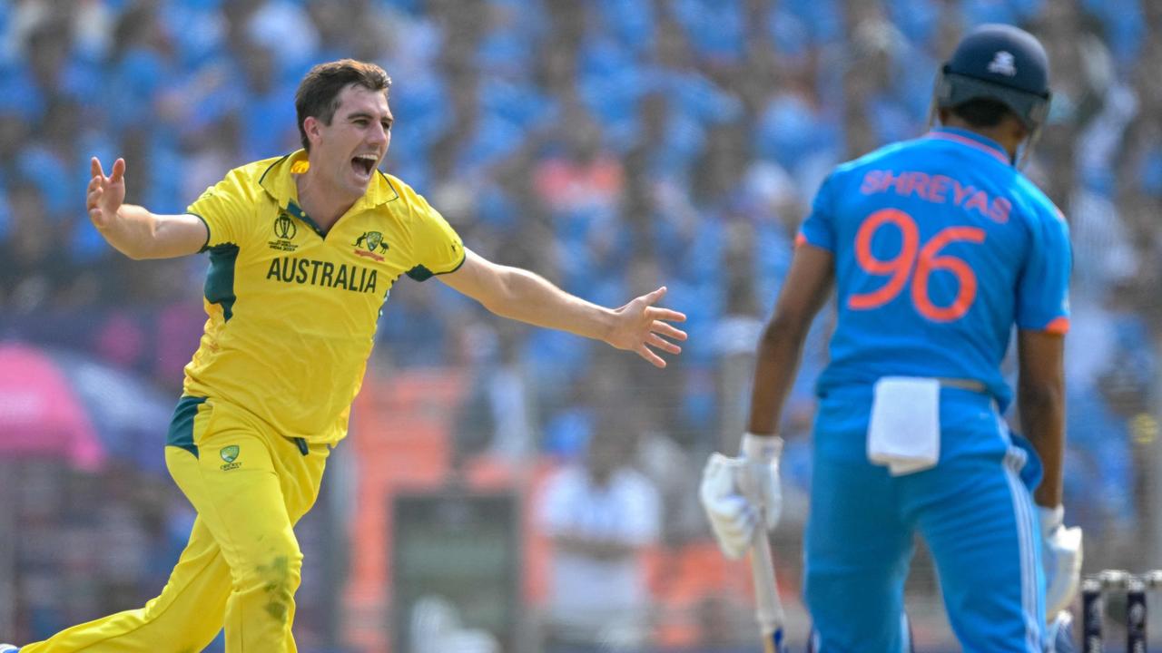 Pat Cummins celebrates after taking the wicket of Shreyas Iyer. (Photo by Sajjad HUSSAIN / AFP) /