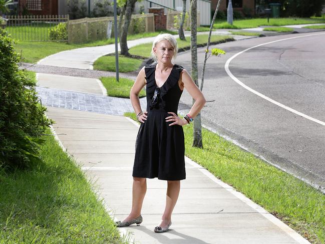 Kylie Sutherland on newly built footpath outsider her home last year. She was furious about having to pay half the cost of it. Picture by Mark Scott