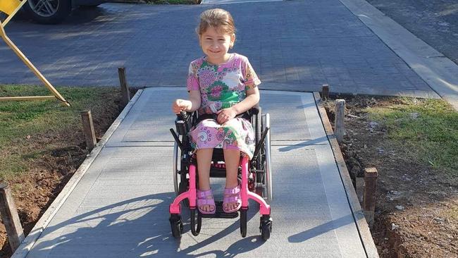 Leah Raish using the new pavement outside her home built by Liverpool Council. Picture: Supplied.