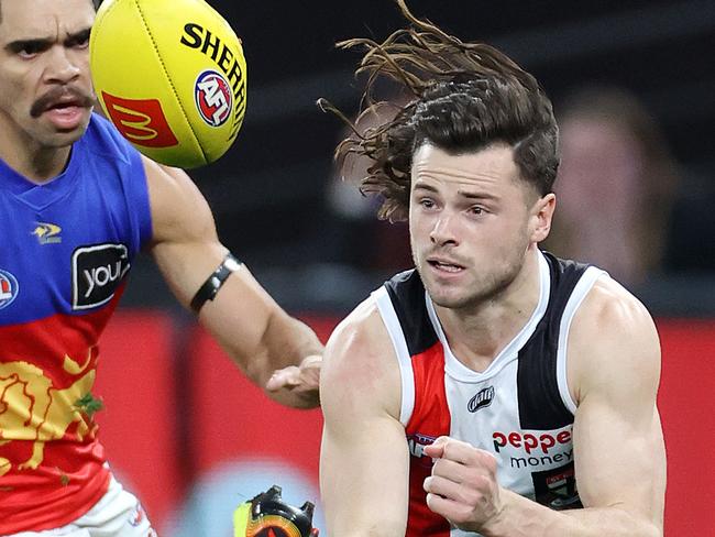 2022 AFL Football Round 22 - St Kilda Saints V Brisbane Lions at Marvel Stadium. Jack Sinclair of the Saints gets his handball away. Picture: Mark Stewart