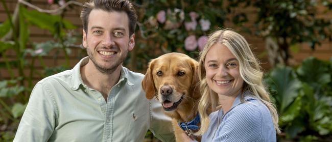 Liberal MP for Bragg Jack Batty with his partner Charlotte Thomas and their dog Trooper at their home in Wattle Park. Picture: Naomi Jellicoe