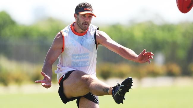 Shane Mumford kicks for goal at GWS training. Picture: Phil Hillyard